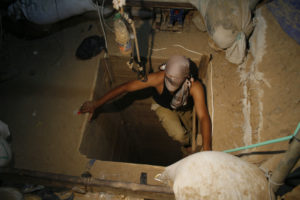 A terrorist emerges from a tunnel in Gaza. (Khaled Omar/propaimages)