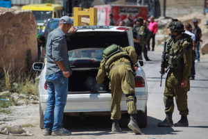 IDF soldiers search an Arab car. (Photo: Photo: Hadas Parush/Flash90)