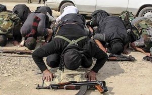 ISIS terrorists in prayer. (barnabasfund.org)