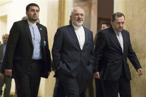 Iran's Foreign Minister  Zarif, center, walks away after talks with US representatives. (AP Photo/Brian Snyder)
