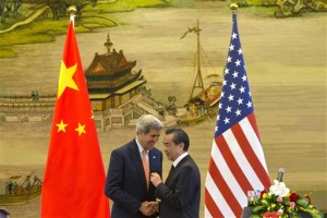 US Secretary of State John Kerry (L) and Chinese Foreign Minister Wang Yi on Saturday following a press conference in Beijing. (AP/Ng Han Guan)