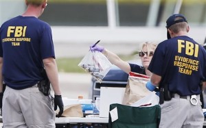 FBI investigators document evidence outside the Texas community center on Monday. (AP Photo/Brandon Wade)