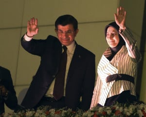 Turkish Prime Minister and AKP head Ahmet Davutoglu waves to supporters with his wife, Sare. 
