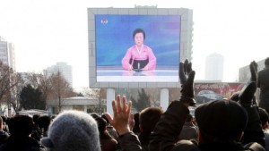 North Koreans watch a news broadcast on a video screen outside Pyongyang Railway Station on Wednesday. (AP/Kim Kwang Hyon)