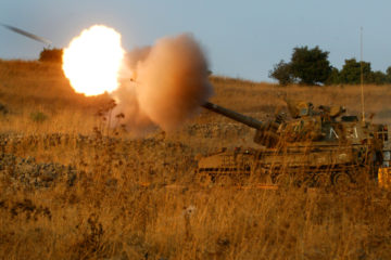 An Israeli mobile artillery piece fires a shell. (Olivier Fitoussi/Flash 90)