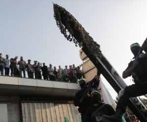 Hamas terrorists show the M-75 home-made rocket in a military parade. (Wissam Nassar/Flash90)