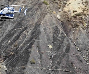 A French helicopter hovers over the site of the crash. (REUTERS/Emmanuel Foudrot)