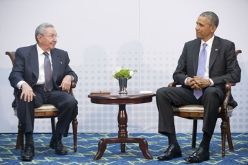 U.S. President Barack Obama, right, meets with Cuban President Raul Castro at the Summit of the Americas in Panama City, Panama on Saturday, April 11, 2015. The leaders of the United States and Cuba held their first formal meeting in more than half a century on Saturday, clearing the way for a normalization of relations that had seemed unthinkable to both Cubans and Americans for generations. (AP Photo/Pablo Martinez Monsivais)
