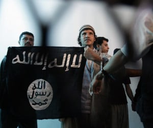 AQAP supporter holds ISIS flag in Yemen