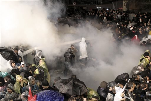 Turkey seizes opposition newspaper; riot police fire tear gas at protesters