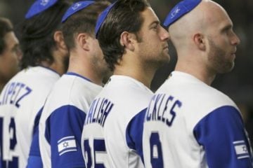 Nick Rickles (R) and Jake Kalish (2R) and others before Israel's game against the Netherlands