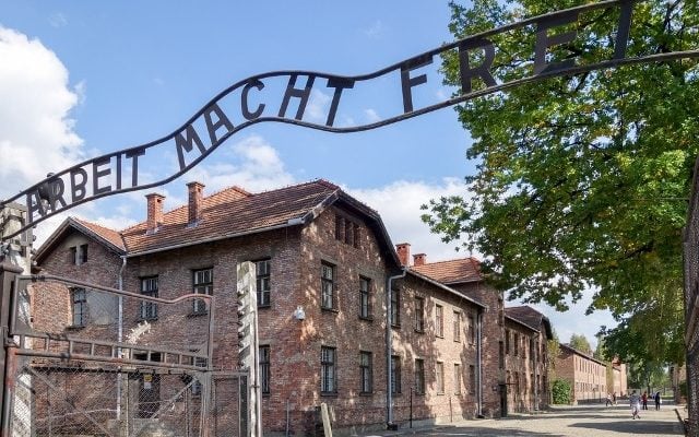 Group stages lewd protest at entrance to Auschwitz