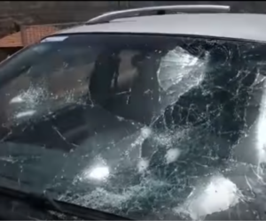 Car damaged by rioters in Huwara