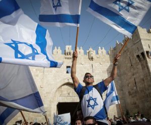 Dancing with Israeli flags at Kotel