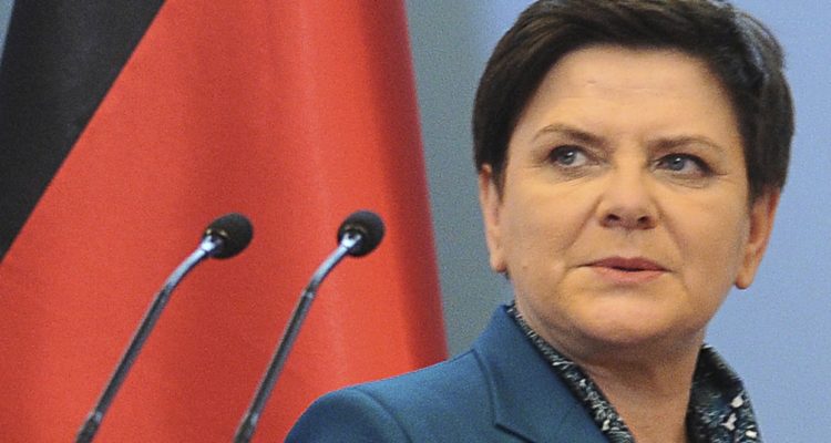Polish PM implicitly defends stance on migrants at Auschwitz