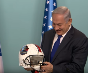 Benjamin Netanyahu with football helmet