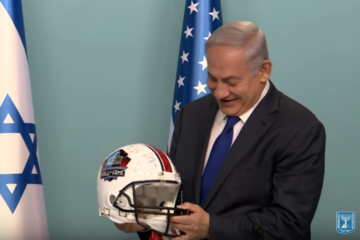 Benjamin Netanyahu with football helmet