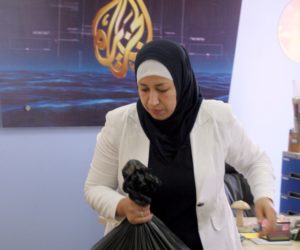 An employee of the Arab news station Al-Jazeera packs up in the network's Ramallah office. (AP Photo/Majdi Mohammed)