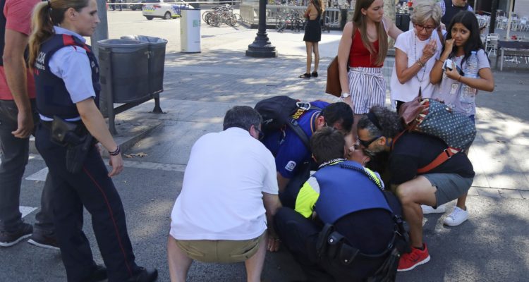 Van plows into crowd in Barcelona; at least 14 dead, 100 injured
