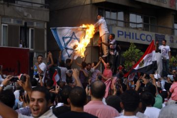 Egyptians cause mayhem outside the Israeli Embassy in Cairo in 2011. (AP Photo/Khalil Hamra, File)