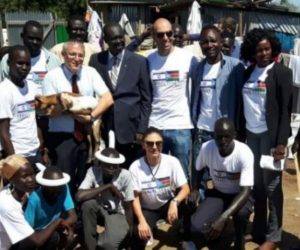 Israel's Ambassador to South Sudan Hanan Goder hands out food aid.