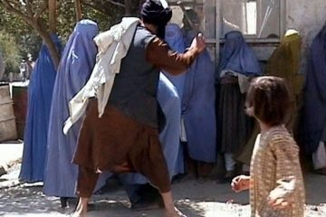 Taliban beating woman who went in public without a burqa