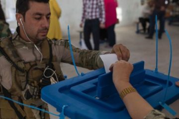 Kurdish security guard votes in Kirkuk