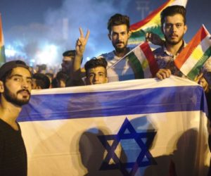 Kurdish demonstrators wave Israeli flags