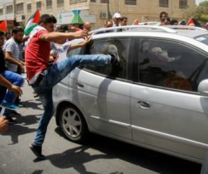 Violent Palestinian mob attacks car