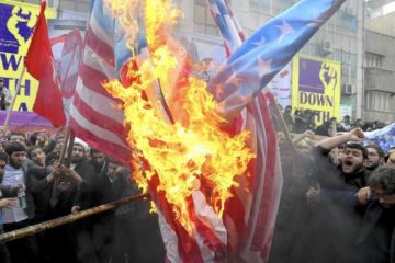 Iranian demonstrators burn representations of US flag Oct. 4, 2015, during rally at former US Embassy in Tehran