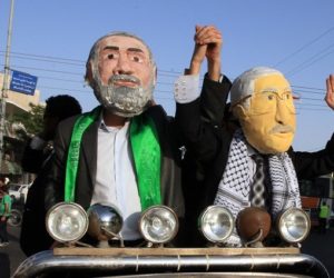 Palestinians dressed as Fatah's Mahmoud Abbas (L) and Hamas' Ismail Haniyeh. (Wissam Nassar/Flash90)