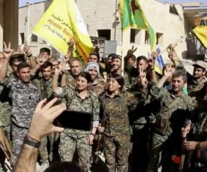 Fighters from the Syrian Democratic Forces celebrate Raqqa victory (AP)