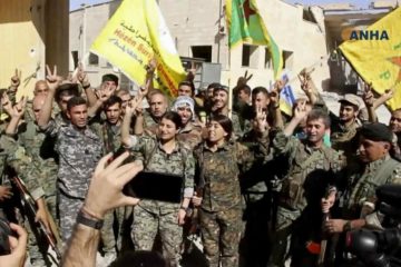 Fighters from the Syrian Democratic Forces celebrate Raqqa victory (AP)