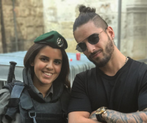 Colombian pop star Maluma with an IDF soldier. (Maluma/Instagram)
