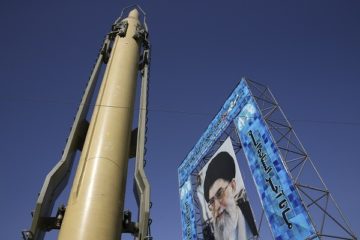 Ghadr-F missile next to Ayatollah Ali Khamenei poster. (AP Photo/Vahid Salemi, File)