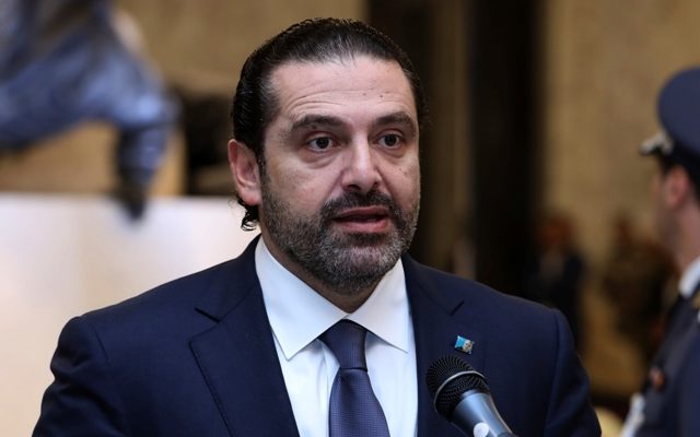 Back in Beirut Lebanese PM puts resignation on hold