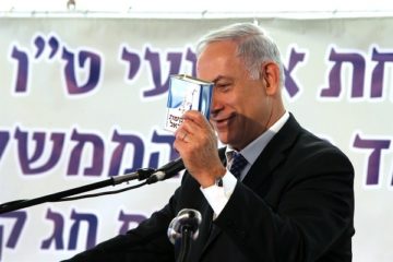 Benjamin Netanyahu with a JNF collection box. (Amit Shabi/Flash 90)