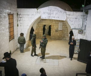 Jews pray at Joseph's Tomb under IDF guard. (Gershon Elinson/FLASH90)