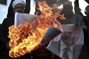 Palestinians burn Trump Netanyahu posters
