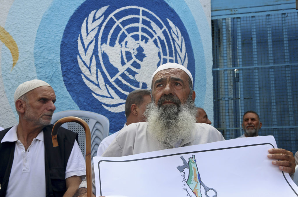 Palestinians in front of UNRWA headquarters in Gaza. (AP/Adel Hana)
