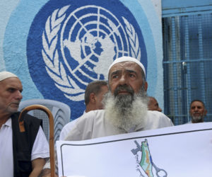 Palestinians in front of UNRWA headquarters in Gaza. (AP/Adel Hana)
