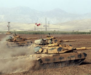 Turkish army tanks near the Habur border gate with Iraq. (DHA-Depo Photos via AP )