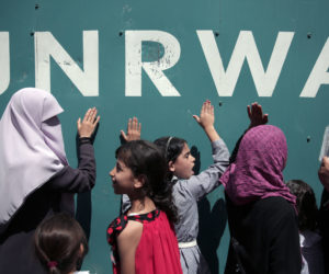 Palestinians at UNRWA HQ. (AP Photo/Khalil Hamra)