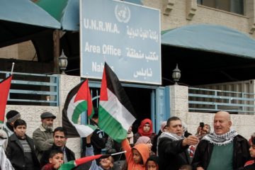 Palestinians at UNRWA headquarters. (Nasser Ishtayeh/Flash90)