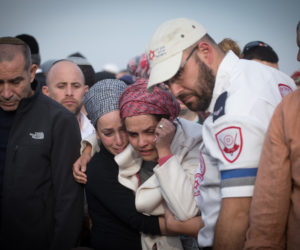 Yael Shevach (C), widow of Rabbi Raziel Shevach at her husband's funeral. (Miriam Alster/Flash90)