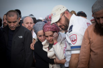 Yael Shevach (C), widow of Rabbi Raziel Shevach at her husband's funeral. (Miriam Alster/Flash90)