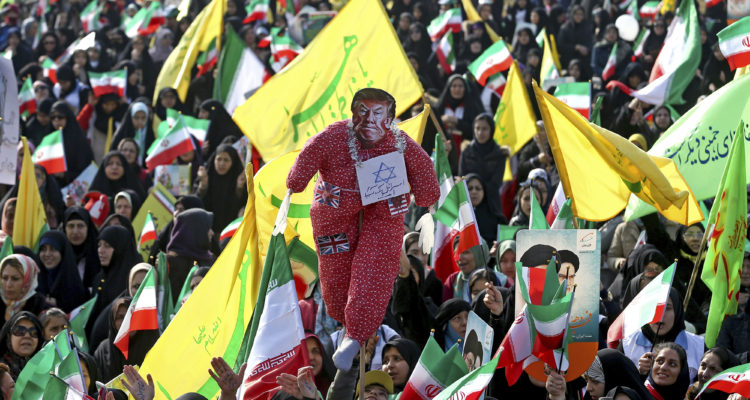 Iran marks anniversary of Islamic Revolution with missiles, burning of flags