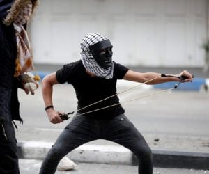 Palestinian terrorist throws rocks