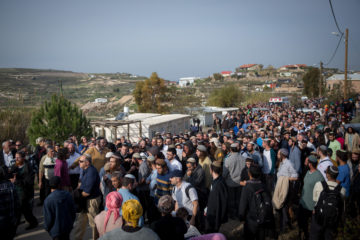 Friends and family attend the funeral of Rabbi Raziel Shevach in Havat Gilad. (Miriam Alster/Flash90)