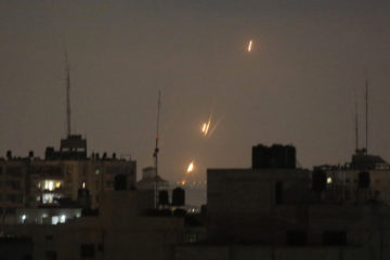 Flames of rockets fired by Palestinian Islamists are seen over Gaza Strip. (AP Photo/Hatem Moussa)